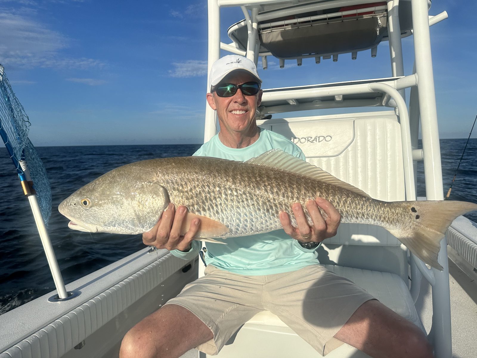 Redfish held up in the cockpit of the Dorado