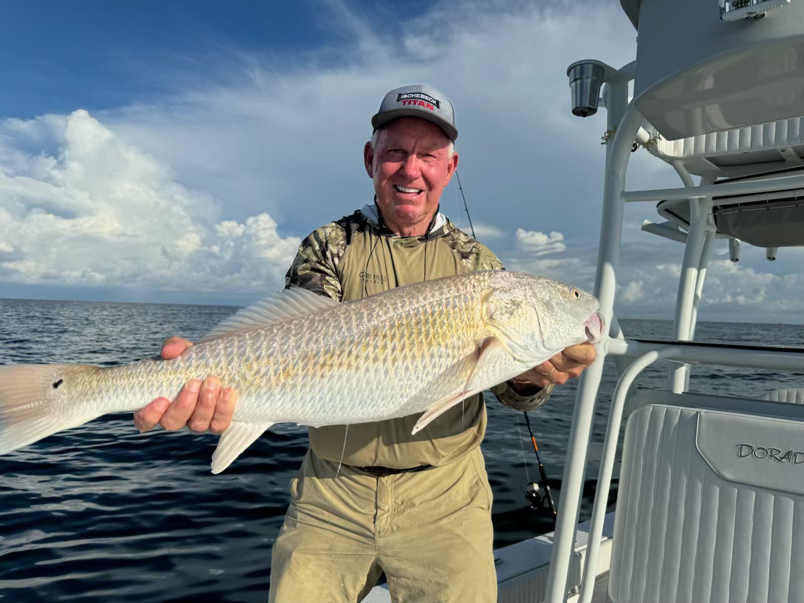 Angler holding a big bull redfish on the Dorado